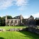 Grass growing amid the stone ruins of a medieval monastery